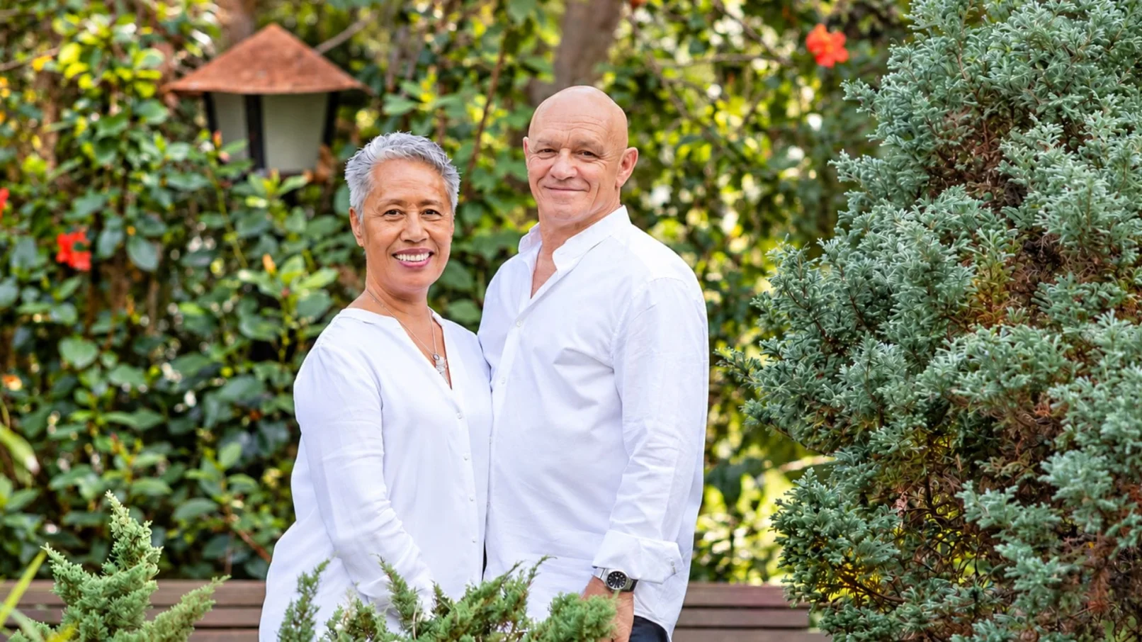 Iva and Neil, founders of Monad Centre of Balance, in a garden
